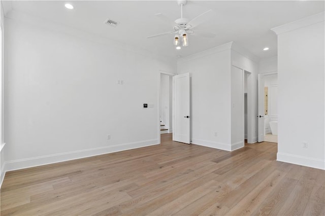 empty room with crown molding, ceiling fan, and light wood-type flooring