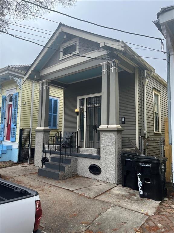 view of side of property with a porch