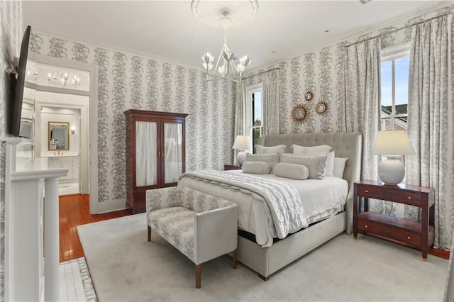 bedroom featuring an inviting chandelier, crown molding, and wood-type flooring