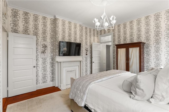 bedroom featuring an inviting chandelier, crown molding, and hardwood / wood-style flooring