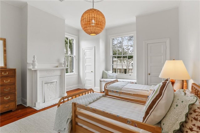 bedroom with hardwood / wood-style flooring