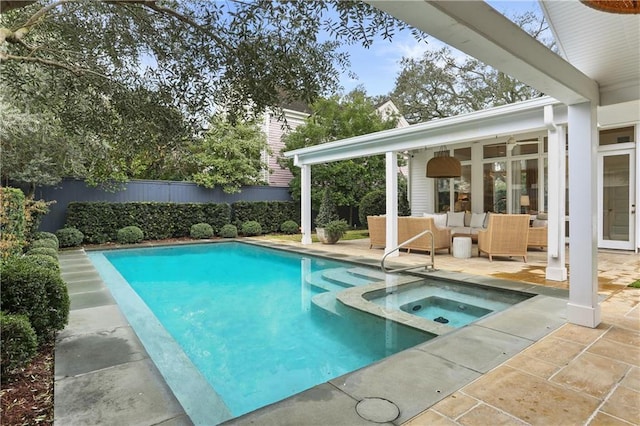 view of swimming pool featuring an in ground hot tub, an outdoor hangout area, and a patio area