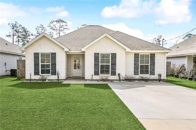 view of front of home featuring a front lawn and central air condition unit