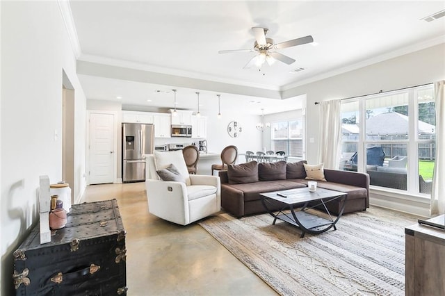 living room featuring crown molding and ceiling fan