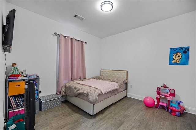 bedroom featuring hardwood / wood-style flooring