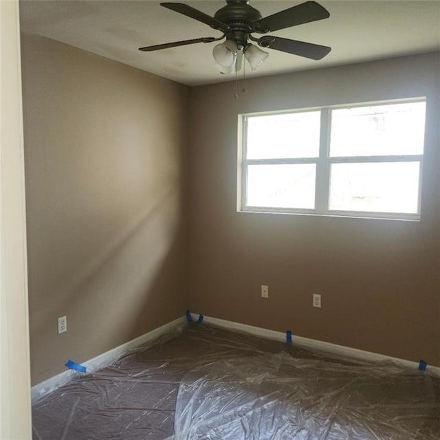 2404 Francis Ave, Violet, LA 70092 - spare room with baseboards and a ceiling fan