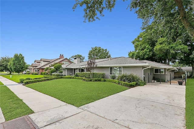 ranch-style house with a front lawn, a gate, and concrete driveway