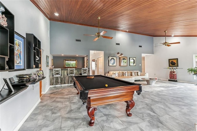 recreation room with visible vents, wooden ceiling, high vaulted ceiling, and ornamental molding