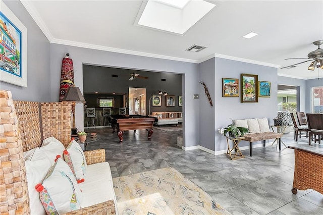 game room with visible vents, a skylight, a ceiling fan, and ornamental molding