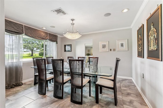 dining space featuring visible vents, baseboards, and crown molding