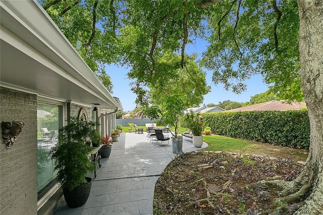 view of yard featuring outdoor dining space and fence private yard