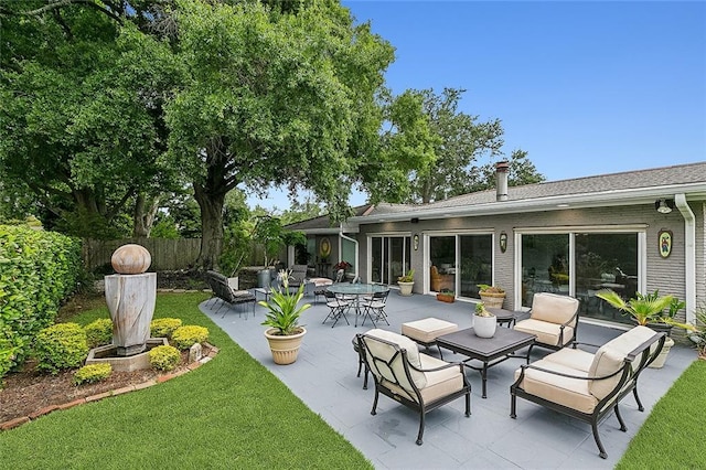 view of patio / terrace with outdoor lounge area and fence