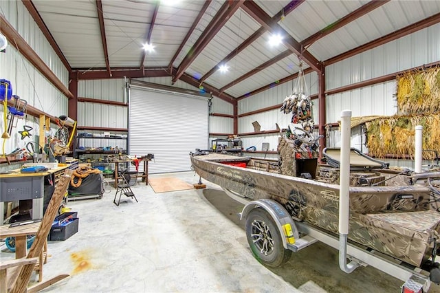 garage featuring a workshop area and metal wall