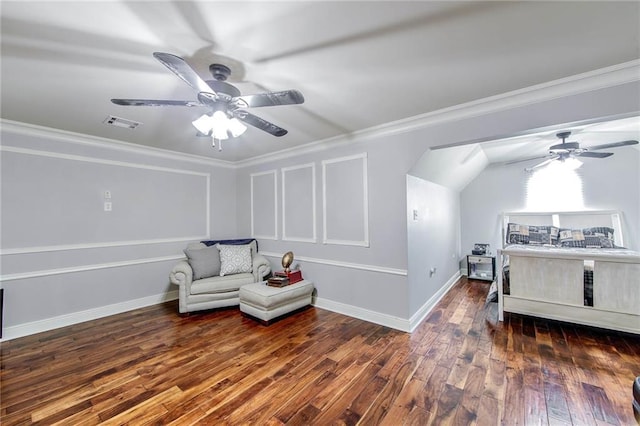 living area featuring visible vents, baseboards, hardwood / wood-style flooring, ceiling fan, and ornamental molding