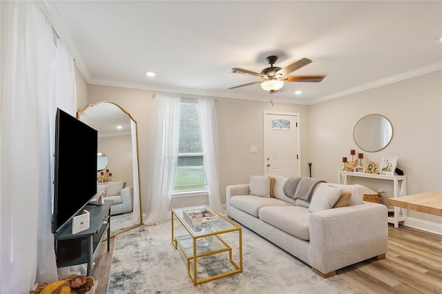 living area with ceiling fan, recessed lighting, wood finished floors, and crown molding