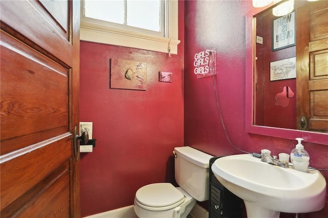 bathroom featuring sink and toilet