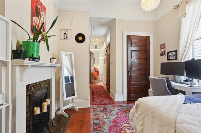 bedroom featuring dark wood-type flooring and crown molding