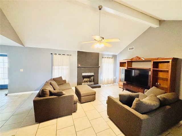 living room with light tile patterned flooring, ceiling fan, a fireplace, and beam ceiling