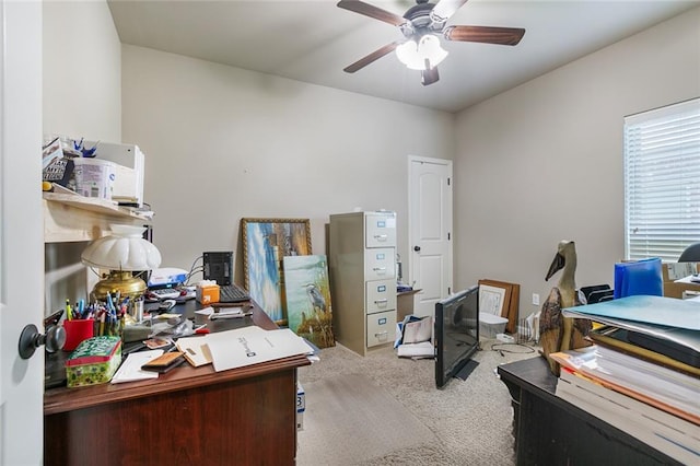 office area featuring light carpet and ceiling fan