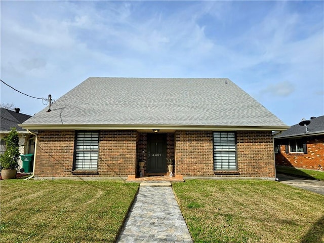 view of front of home with a front lawn