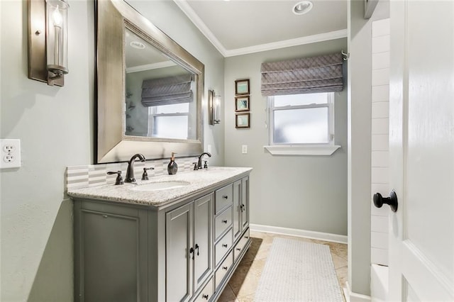 bathroom featuring vanity, crown molding, and a wealth of natural light