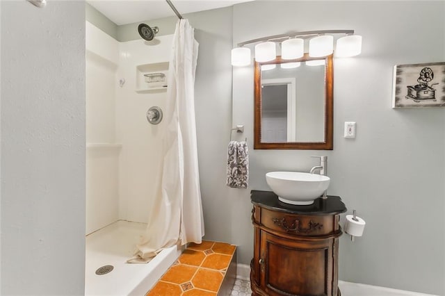 bathroom featuring vanity and curtained shower