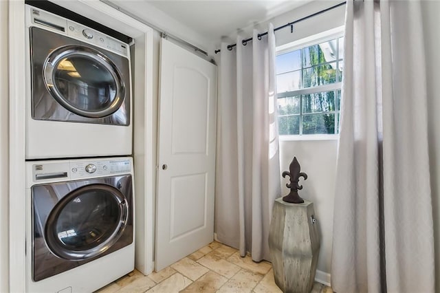 laundry area featuring stacked washing maching and dryer