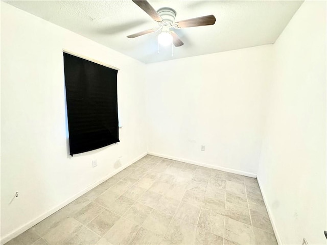 unfurnished room with ceiling fan