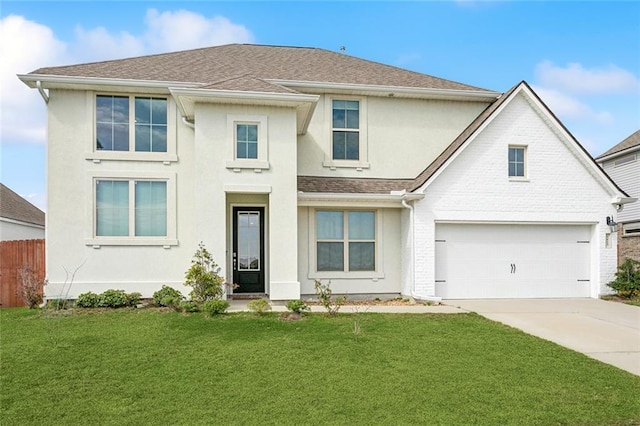 view of front of home with a garage and a front yard