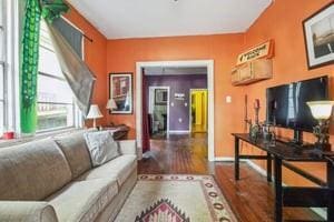 2226 Saint Bernard Ave, New Orleans, LA 70119 - living area with wood finished floors and baseboards
