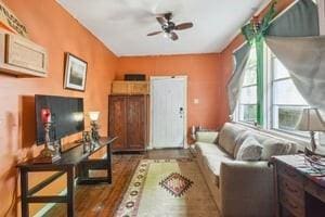 2226 Saint Bernard Ave, New Orleans, LA 70119 - living room featuring a ceiling fan and wood finished floors
