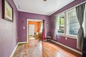 2226 Saint Bernard Ave, New Orleans, LA 70119 - spare room featuring baseboards and wood finished floors