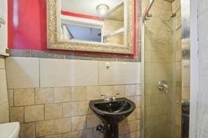 2226 Saint Bernard Ave, New Orleans, LA 70119 - full bath with tile walls and a shower stall