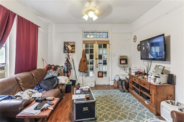 2226 Saint Bernard Ave, New Orleans, LA 70119 - living area with ceiling fan, heating unit, and dark wood finished floors