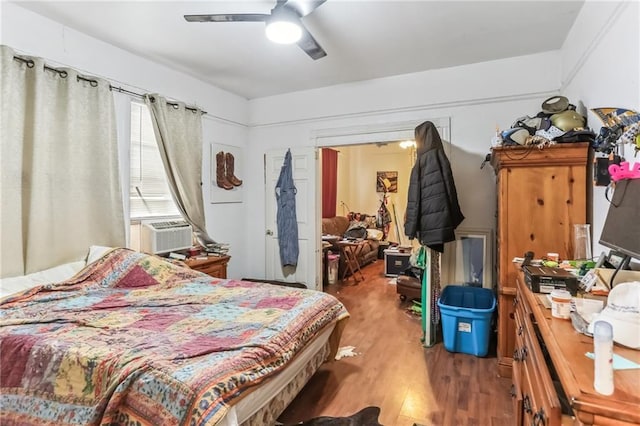 2226 Saint Bernard Ave, New Orleans, LA 70119 - bedroom with wood finished floors, cooling unit, and a ceiling fan