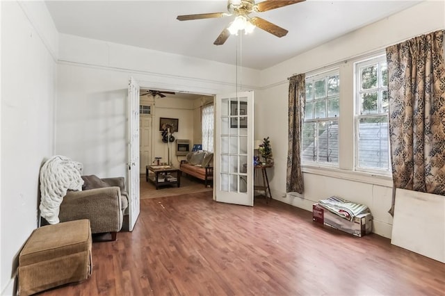 2226 Saint Bernard Ave, New Orleans, LA 70119 - sitting room featuring ceiling fan, wood finished floors, and french doors