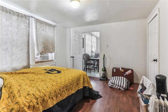 2226 Saint Bernard Ave, New Orleans, LA 70119 - bedroom with wood finished floors and cooling unit