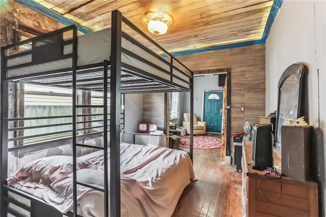 2226 Saint Bernard Ave, New Orleans, LA 70119 - bedroom featuring wood ceiling, wood walls, and hardwood / wood-style flooring