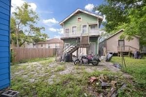 2226 Saint Bernard Ave, New Orleans, LA 70119 - back of house featuring stairway