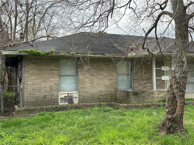 view of property exterior with a yard