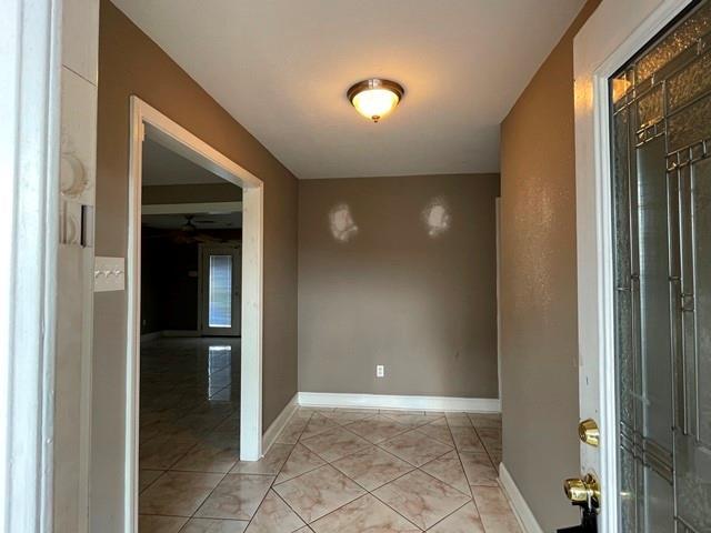 interior space featuring light tile patterned floors