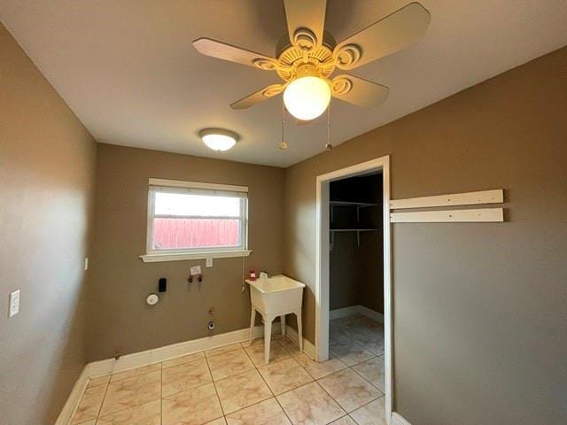 washroom featuring light tile patterned floors and ceiling fan