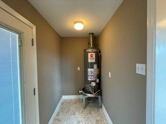 utility room with gas water heater