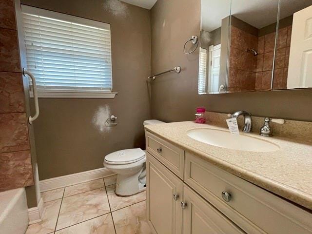 bathroom with tile patterned floors, vanity, and toilet