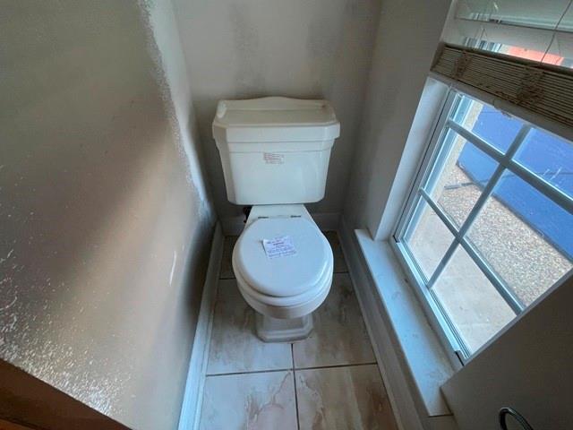 bathroom featuring toilet