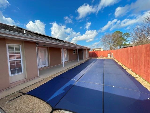 view of swimming pool with a patio area