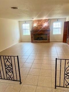 unfurnished living room featuring tile patterned floors