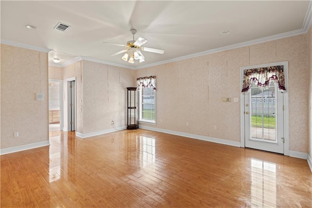 unfurnished room with crown molding and ceiling fan