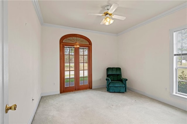 unfurnished room featuring crown molding, light colored carpet, and ceiling fan