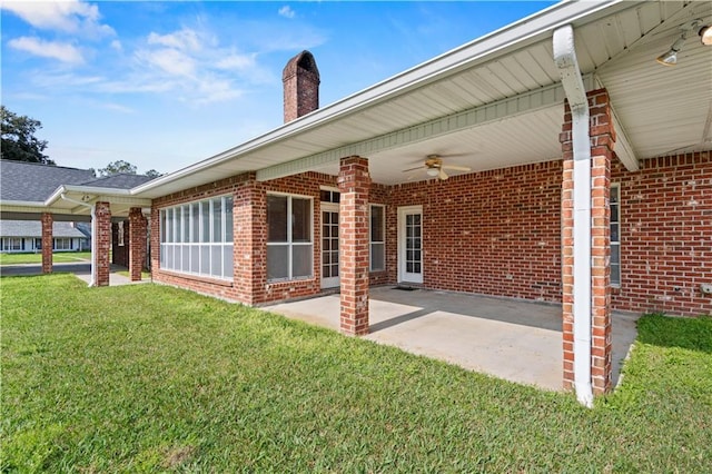 exterior space with ceiling fan